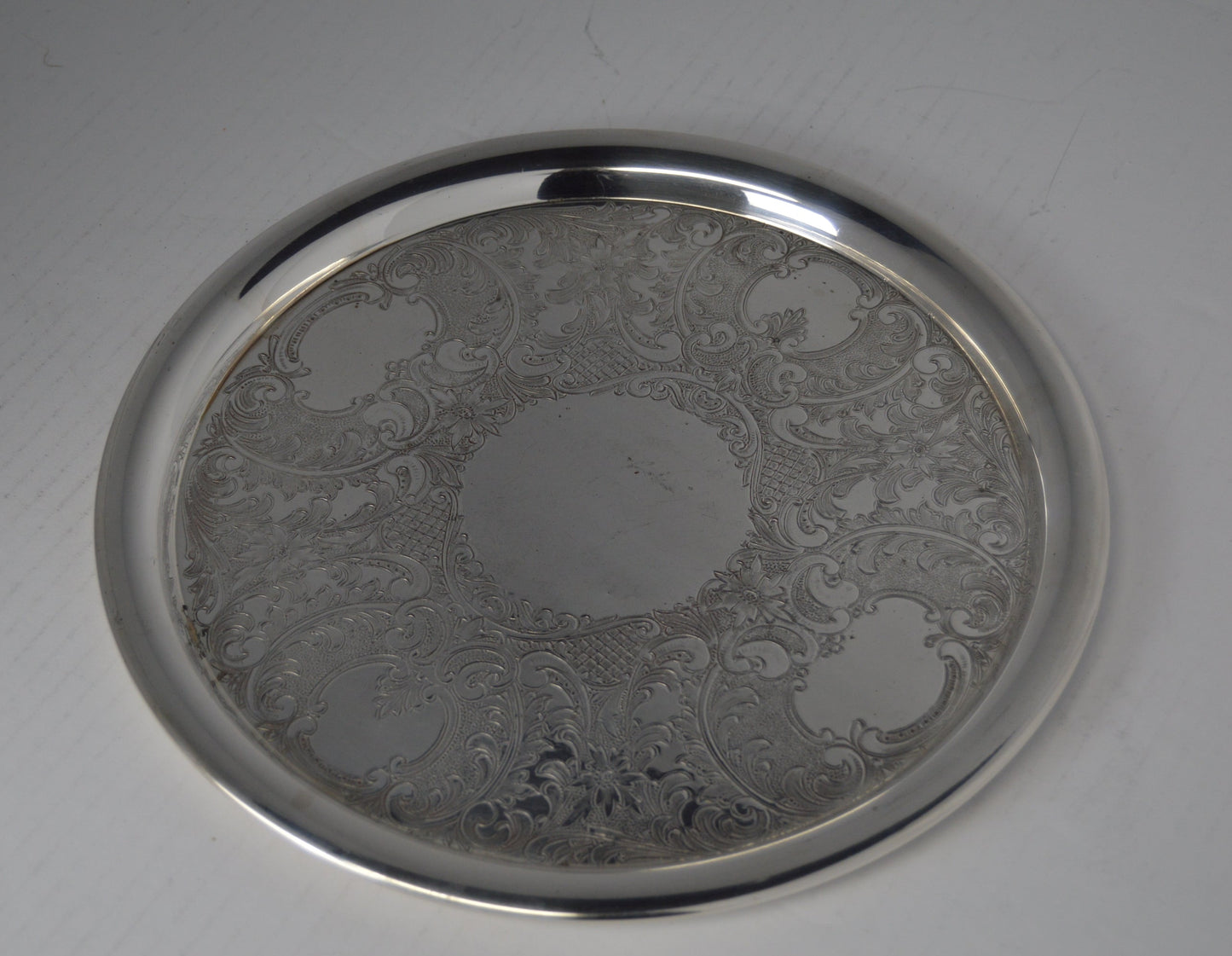 Vintage silver-plated round tray 11 1/2" by Gotham on cooper, pre-owned