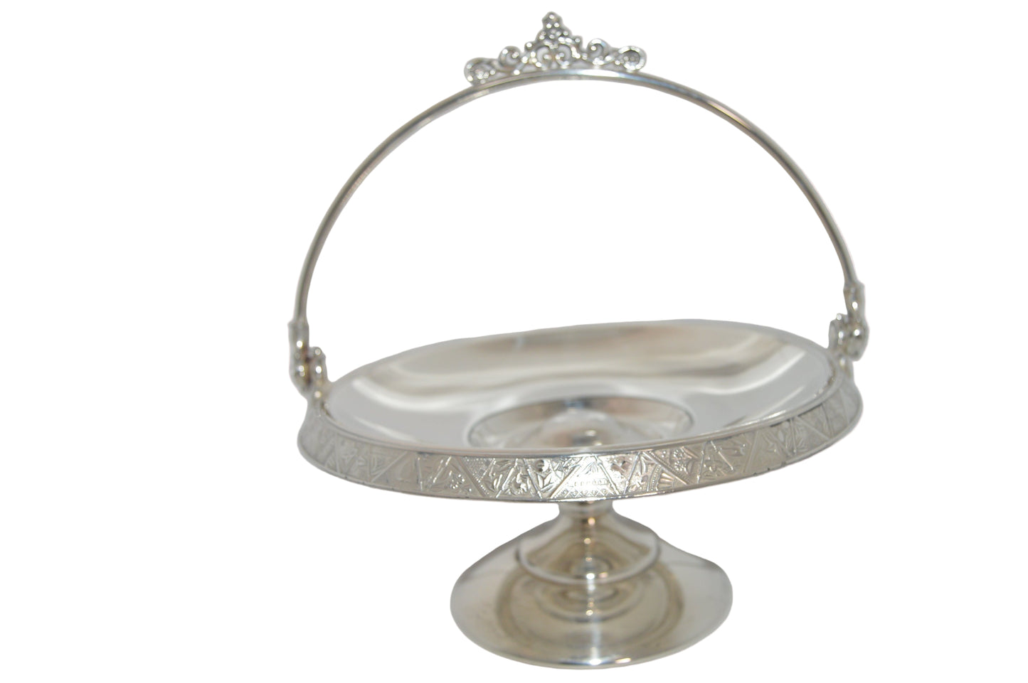 Vintage silver-plated candy dish early 1900's with handle and on pastel.