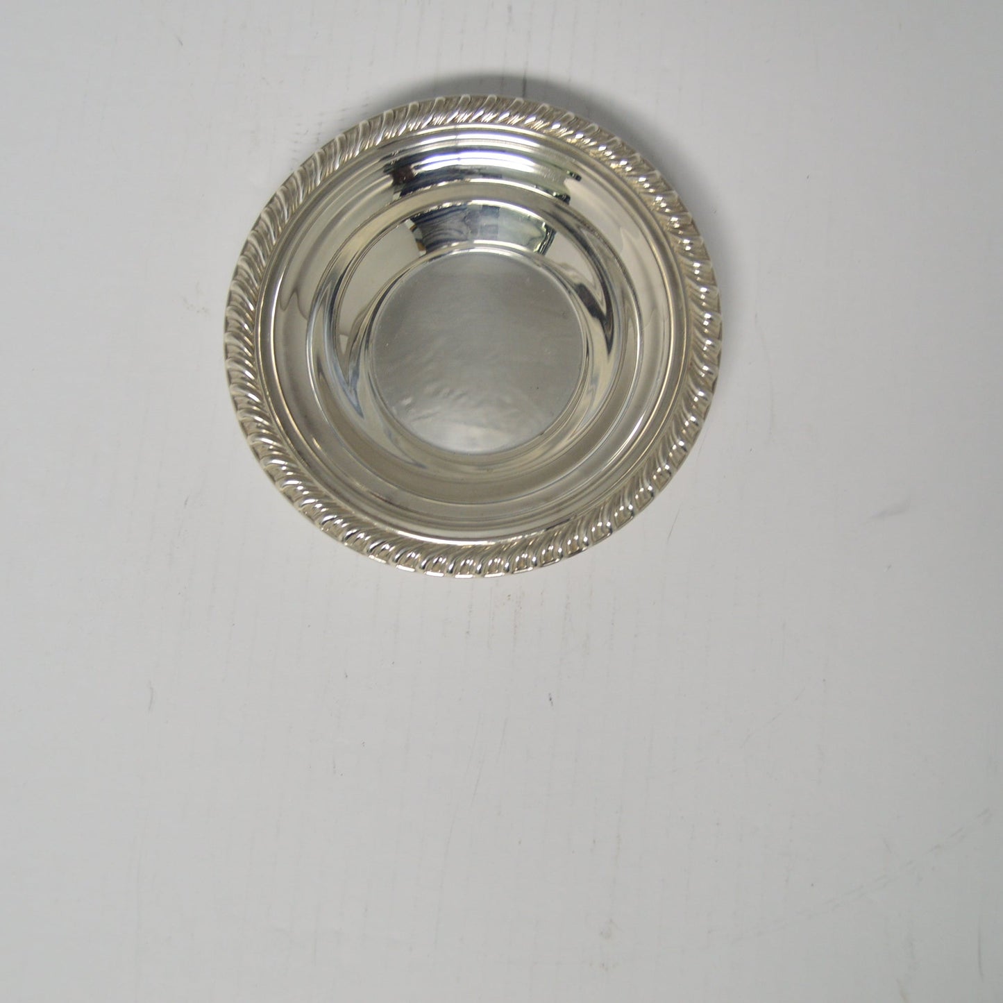 Silver-plated candy/nut dish measuring 6 1/2" wide and 1 1/2" deep excellent condition pre-owned
