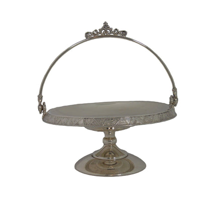 Vintage silver-plated candy dish early 1900's with handle and on pastel.