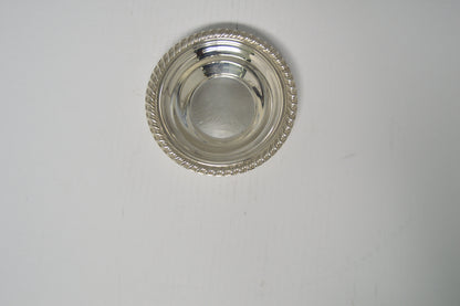 Silver-plated candy/nut dish measuring 6 1/2" wide and 1 1/2" deep excellent condition pre-owned
